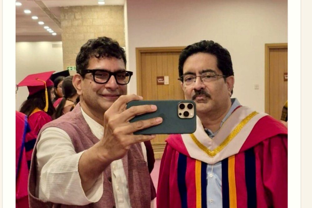 Kashyap Kompella at a public event with Kumar Mangalam Birla