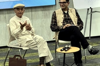 Kashyap Kompella at a public event with Gurcharan Das