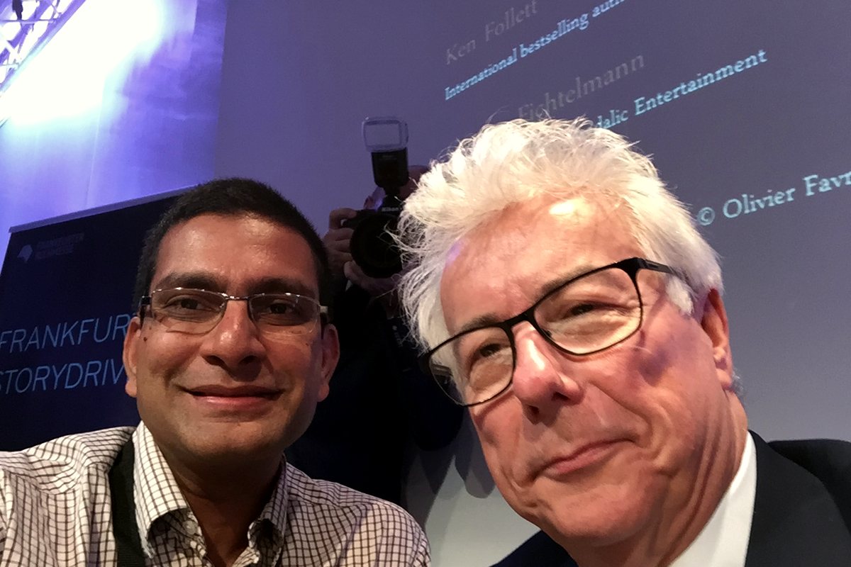 Kashyap Kompella at a public event with Ken Follett