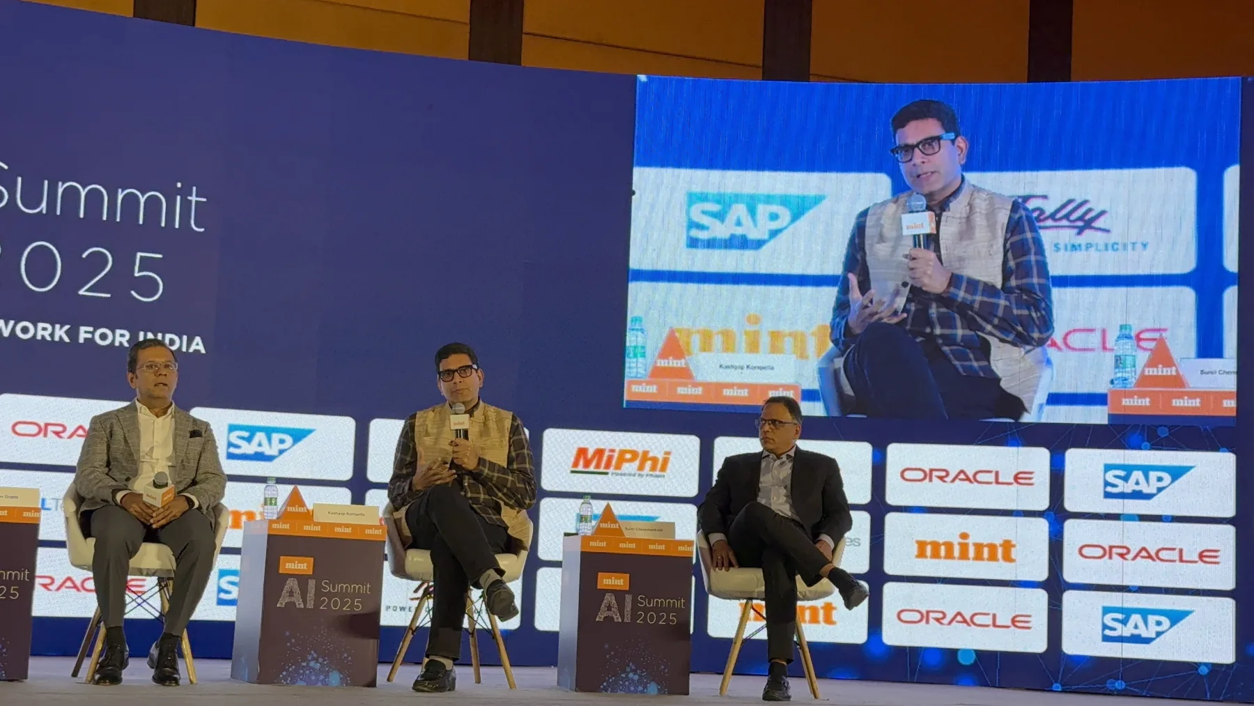Kashyap Kompella speaking on an AI panel at a Mint summit